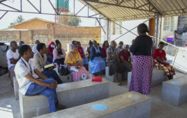 Health workers conduct community engagement in Malawi for TCV