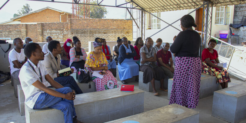 Health workers conduct community engagement in Malawi for TCV