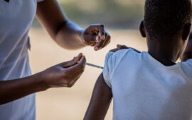 A child receives TCV during Zimbabwe's introduction campaign. Vaccines protect against typhoid during a drought when risk increases.