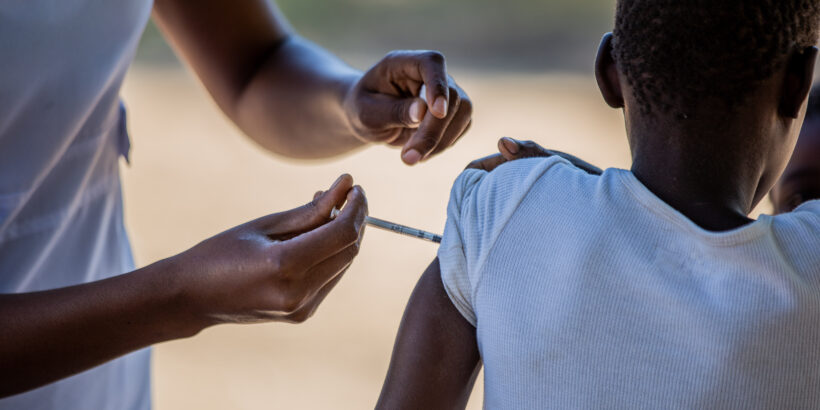 A child receives TCV during Zimbabwe's introduction campaign. Vaccines protect against typhoid during a drought when risk increases.