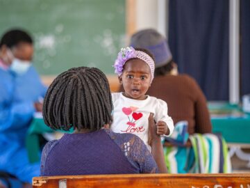 Drug resistance raises the urgency for protection against typhoid. A child waits to receive TCV during Zimbabwe's introduction campaign