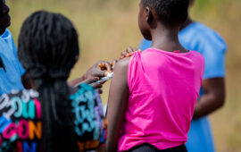 A picture of a girl receiving the typhoid conjugate vaccine (TCV) during an immunization campaign in Malawi.