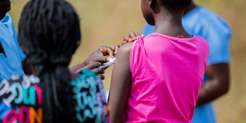 A picture of a girl receiving the typhoid conjugate vaccine (TCV) during an immunization campaign in Malawi.